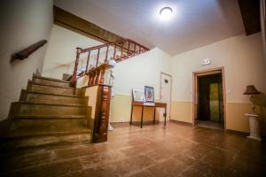 a staircase in a room with a stair case at Castellu Rossu in Lucciana