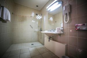 a bathroom with a sink and a shower at Castellu Rossu in Lucciana