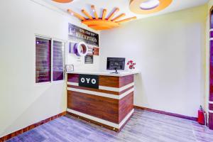 a lobby of a restaurant with a reception desk at Super HOTEL O UTSAV STAY in Jālahalli