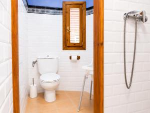 a bathroom with a toilet and a sink at El Cajigar Ordesa Aínsa in Laspuña +34 photos