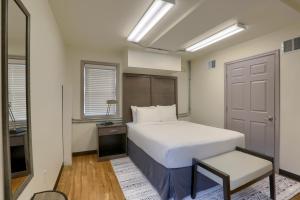 a bedroom with a large white bed and a window at Sweet Stay in Hershey