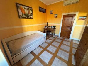 a bedroom with a bed and a table in it at La Parenthèse in Bourg-Saint-Andéol