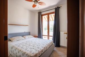 a bedroom with a bed and a window at Casa Stella Marina in Cervia