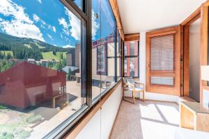 a balcony with a view of the mountains at Village Square West 353 in Copper Mountain