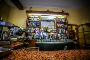 a bar with a lot of bottles of alcohol at Castellu Rossu in Lucciana