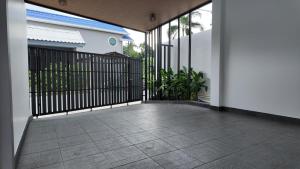 a black gate on a house with a patio at Zoha 2BR Private Pool Villa Bangtao in Thalang