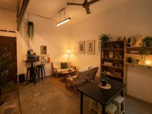 a living room with a table and chairs at F1 Riverside Mee Udang in Malacca