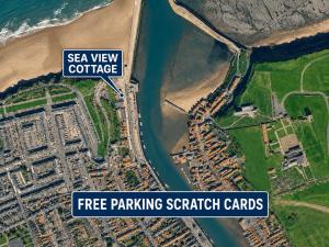a map of a beach with the sea view cottage and free parking scratch cards at Whitby Sea View Cottage Prime Historic Old Town Location in Whitby