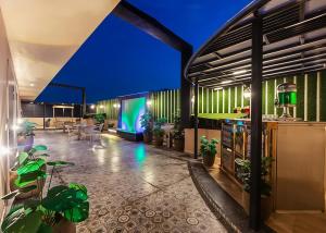 a lobby of a building with potted plants at Hotel The Venue At Delhi Airport IGI in New Delhi