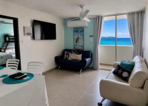 a living room with a view of the ocean at Private Island Oceanview Condo in Fajardo