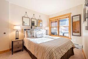 a bedroom with a bed and a window at Copper Springs Lodge 332 in Copper Mountain