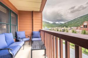 a porch with two chairs and a bench on a balcony at Copper Springs Lodge 332 in Copper Mountain +42 photos