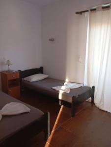 a room with two beds and a window at Denise Villa in Platánion +24 photos