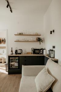 a living room with a couch and a counter at Green Valley Accommodation in Lipovica