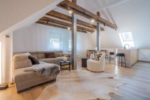 a living room with a couch and a table at Apartmány Ski Telgárt - Telgárt Resort in Telgárt