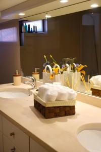 a bathroom with two sinks and a mirror at Casas de São Roque in Vila do Conde +62 photos