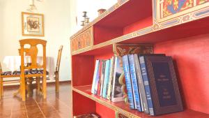 a book shelf with a bunch of books on it at Indigo House in Chefchaouen