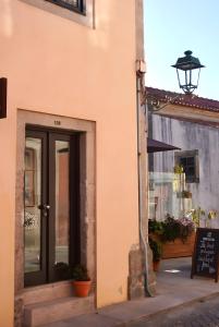 a building with a door on the side of it at Casas de São Roque in Vila do Conde
