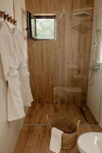 a bathroom with a shower and a sink at Green Valley Accommodation in Lipovica +22 photos