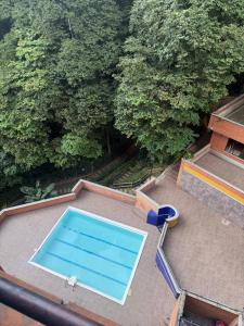 an overhead view of a swimming pool on top of a house at We Rent VIP - San Julián in Medellín