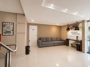 a living room with a couch in a room at Hotel El Pilar by Bsb Inn in Brasília