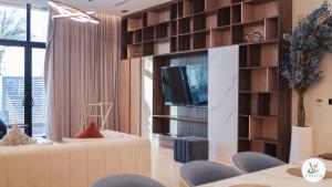 a living room with a couch and a tv at V Beach in Jeddah