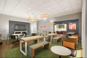 a room with tables and chairs in a room at Spark by Hilton Clifton in Clifton