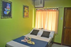 Postel nebo postele na pokoji v ubytování Amelia Homestay
