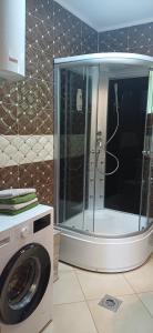 a washing machine and a washer in a bathroom at Nature escape cottage in Cetinje +14 photos