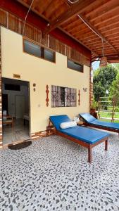 two beds on the patio of a house at Villa Jennifer in Tingo María