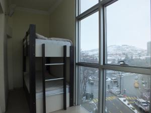 a bunk bed in a room with a window at Otel Nisa in Nevşehir