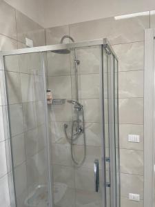 a shower with a glass door in a bathroom at La Volta di Chiara in Roccaforzata +14 photos