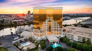 an aerial view of a building with the sunset at Horseshoe Bossier City Hotel & Casino - A Caesars Rewards Destination in Bossier City
