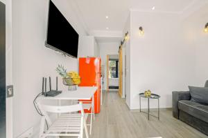 a living room with a table and a couch at InTown Suite in Lefkada