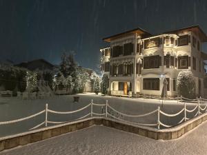 a large house with a fence in front of it at Silk Route in Srinagar