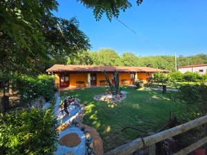 an image of a house with a garden at Bungalow Coronas in Bonorva