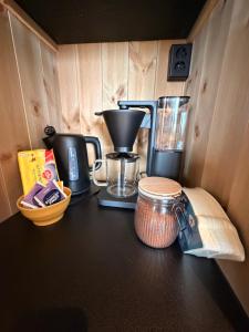 a kitchen counter with a coffee maker and a blender at Reine Viewpoint House in Reine