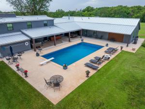 an overhead view of a house with a swimming pool at Whispering Prairie Lodge in Salina