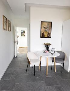 a dining room with a table and two chairs at Villa Bavaria C in Ponta do Sol