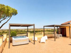 a hot tub on the patio of a house at Puesta del Sol Roma in Rome