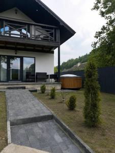 a house with a patio at Foresthillсоttage in Tyshovnitsa