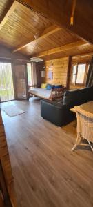 a living room with a couch and a bed at O Meu Retiro in Carrapatelo