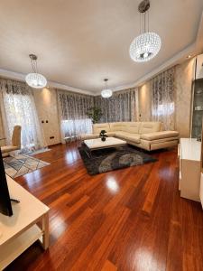 a living room with a couch and a table at Vista Mare Vidikovac in Budva
