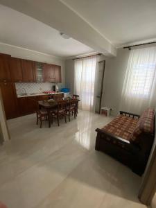 a living room with a couch and a table at Trinacria in Montevago