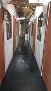 a corridor of a hallway with water on the floor at casa posada cabaña paracas in Paracas +1 photo