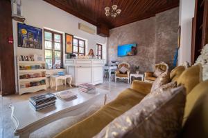 a living room with a couch and a table at La Paloma Hotel in Antalya