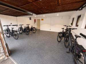 a group of bikes parked in a garage at Pension Sonneck in Pfarrwerfen