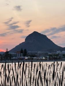 a mountain in the background with a fence in the foreground at piso en puerto de Jávea in Jávea