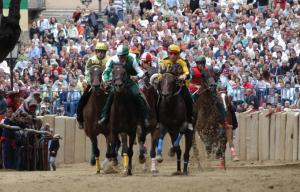 a group of jockeys riding horses at a horse race at Matteotti suite&gare in Asti