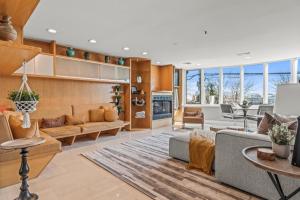 a living room with a couch and a table at 5 bdrm - Heated Indoor Pool - Roof Top Deck in Philadelphia